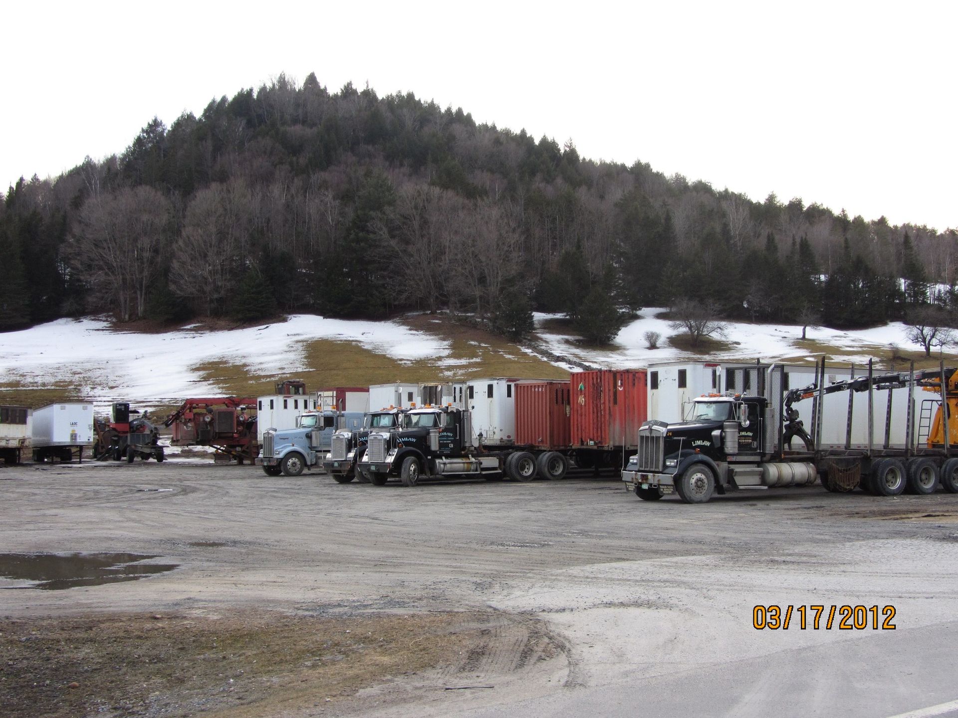 A row of trucks are parked in a parking lot on april 17 2012