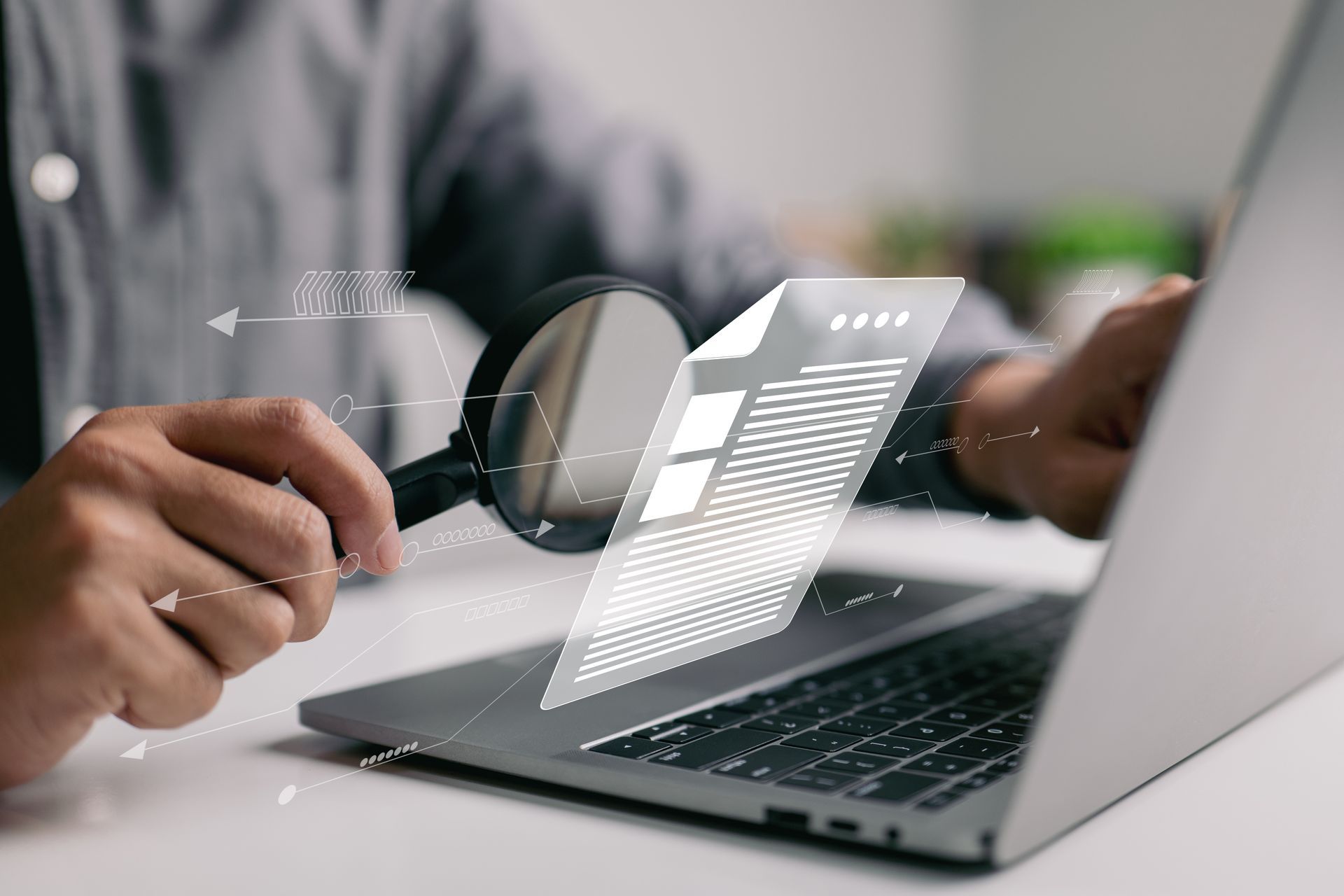 A man is inspecting a document with a magnifier, showcasing certified auditor services.