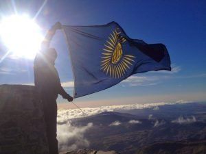 Flag Flown by CG, a wounded soldier on top of Mount Snowdown