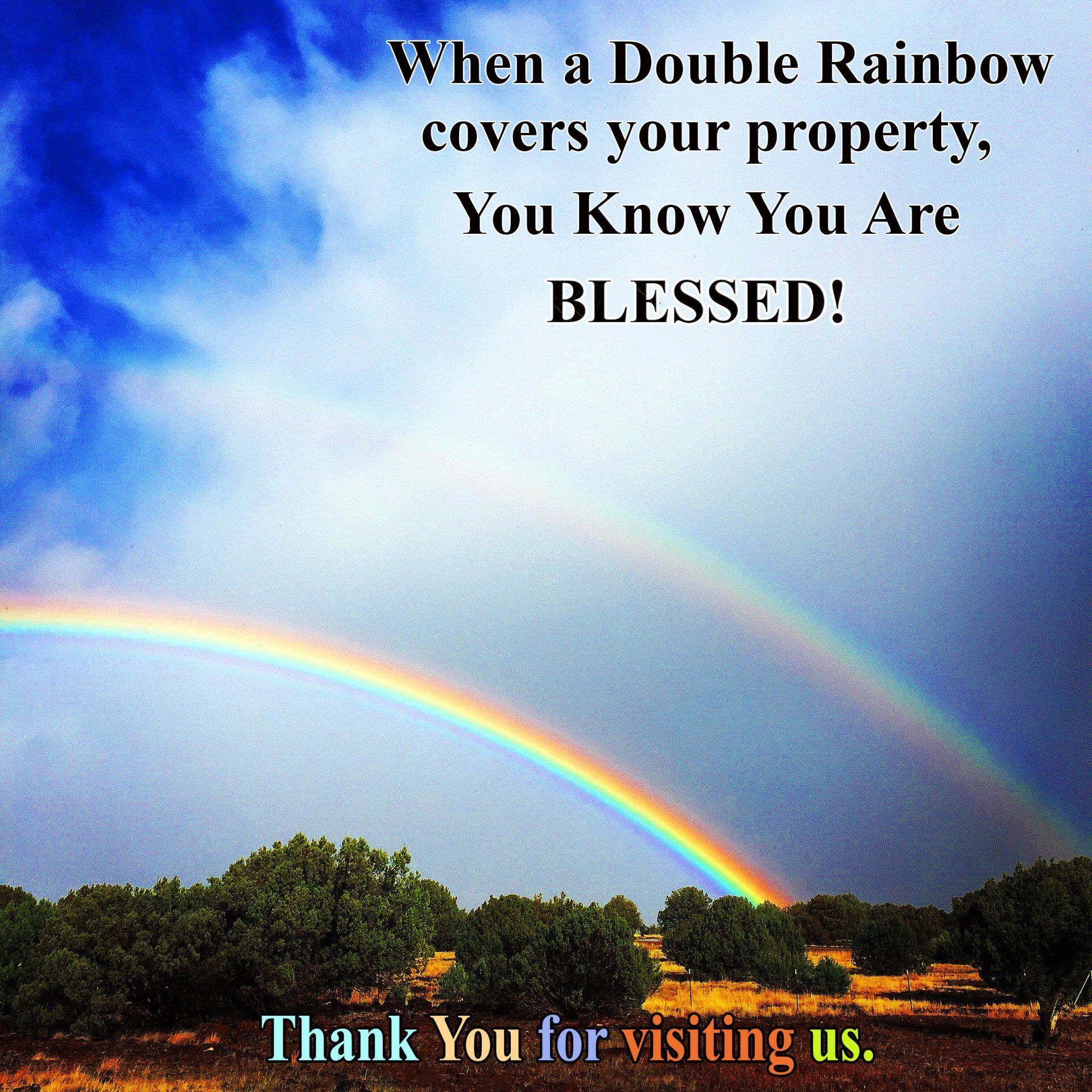 Double rainbow over green trees and field, with text: