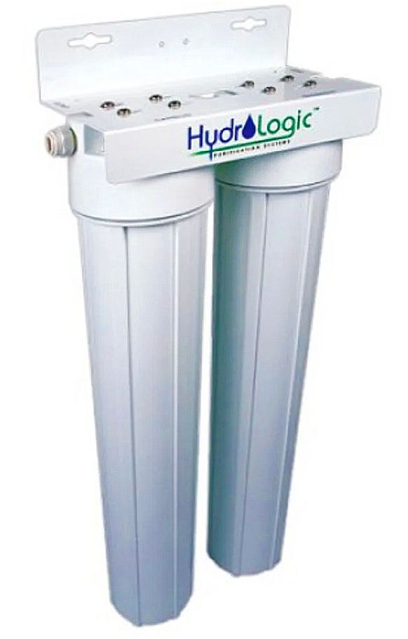 White HydroLogic water filtration system, two cylindrical filter housings, mounted to a bracket.