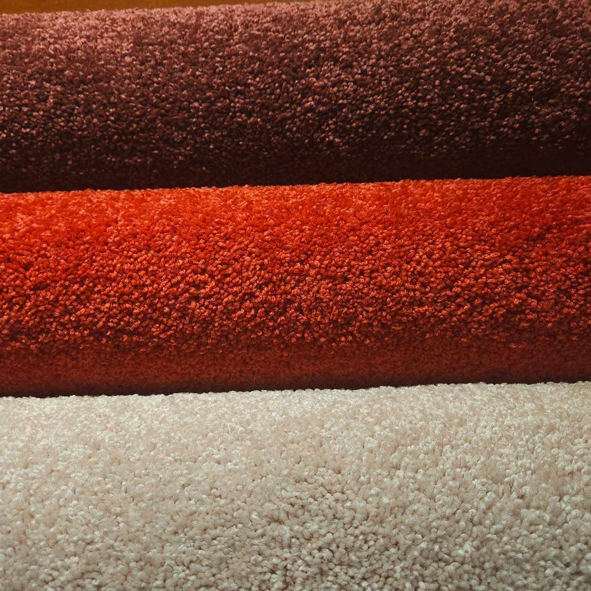 Three Different Colored Carpets Are Stacked on Top of Each Other — Kelwin Coastal Carpets In Kundra Park, QLD