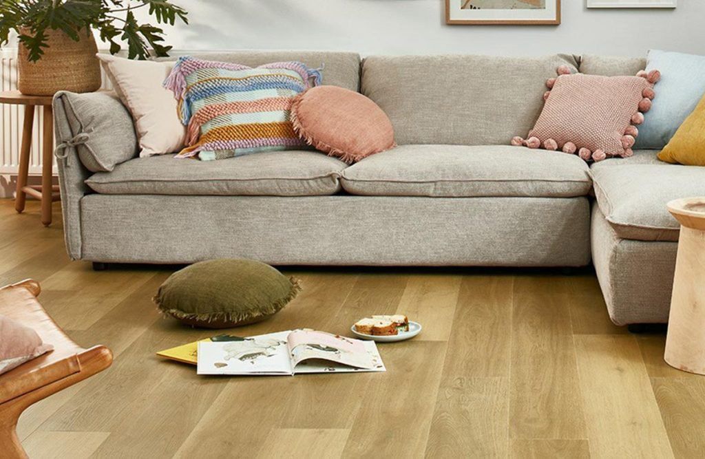 A Living Room with A Couch and Pillows on The Floor — Kelwin Coastal Carpets In Kundra Park, QLD