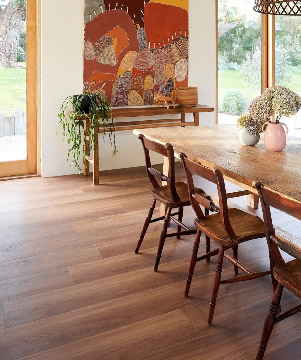 Bright dining room with wooden table — Kelwin Coastal Carpets In Kundra Park, QLD