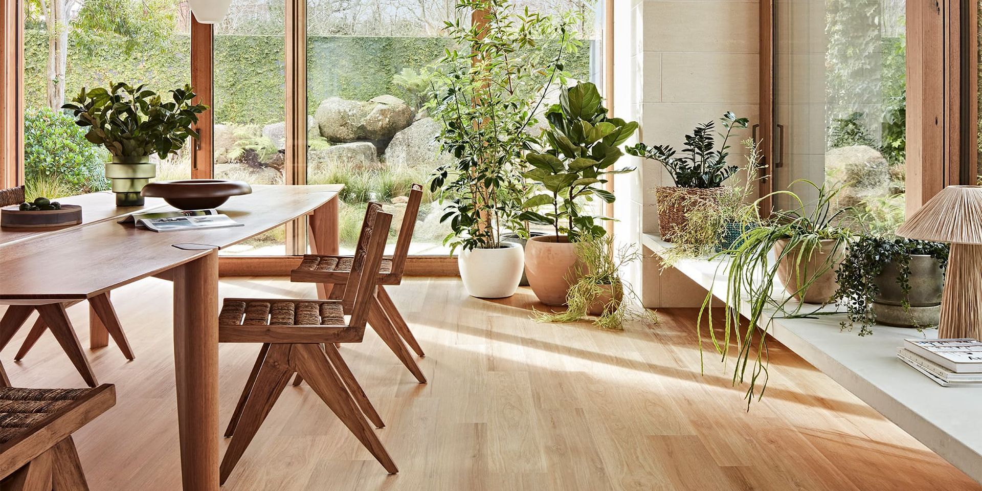 A Kitchen with White Cabinets, Wooden Floors and Stools — Kelwin Coastal Carpets In Gympie, QLD