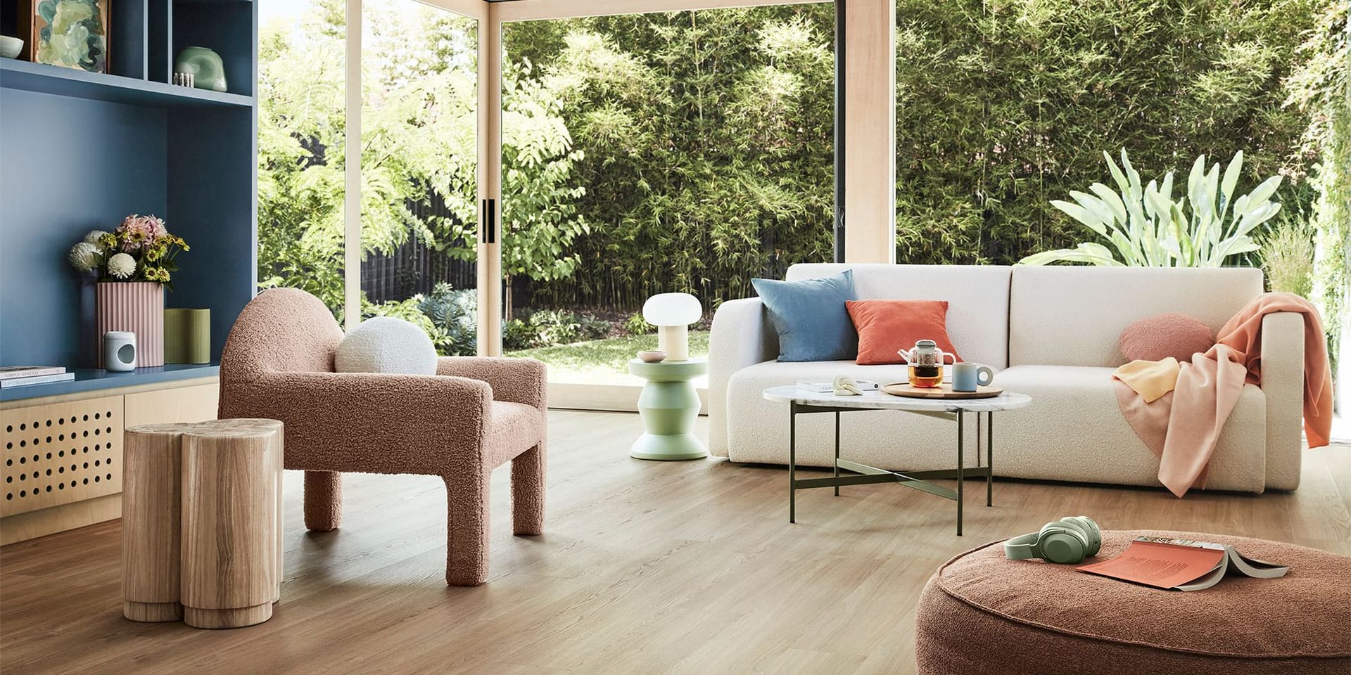 A Kitchen with White Cabinets, Wooden Floors and Stools — Kelwin Coastal Carpets In North Brisbane, QLD
