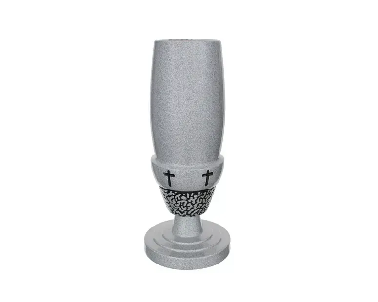 Granite vase with cross details, used for holding flowers at a gravesite.