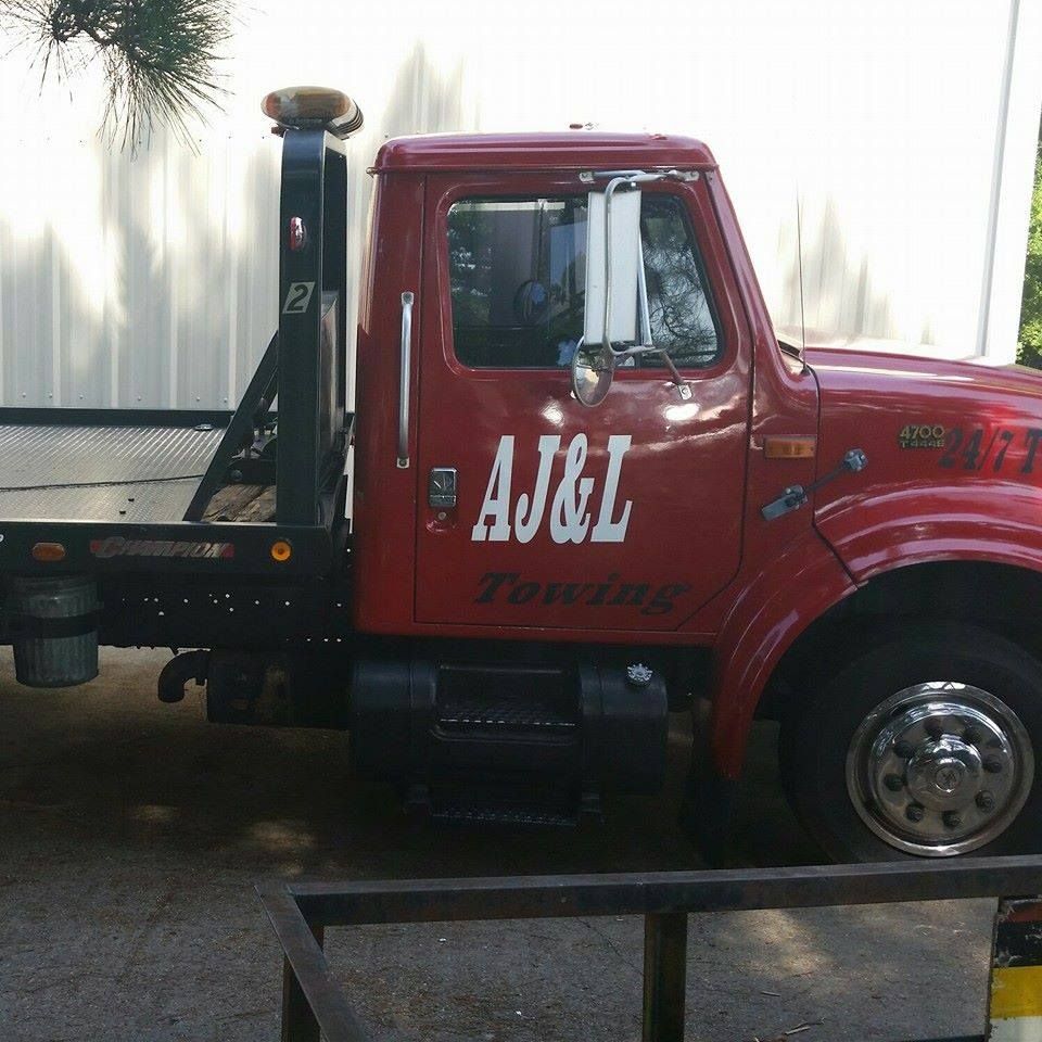 AJ & L Towing logo