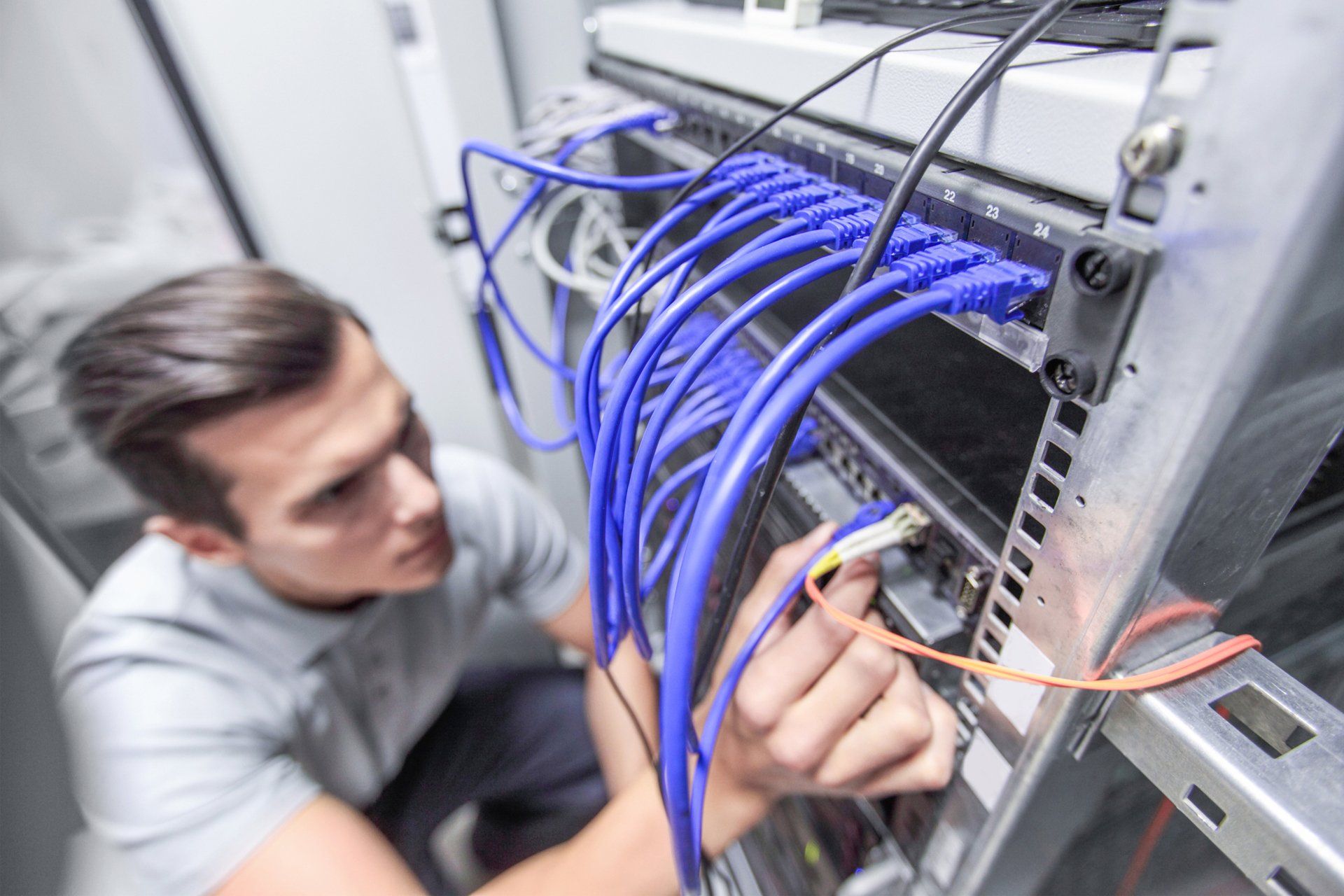 Man Working In Network Server Room — Somersworth, NH — Hampton Technical Services