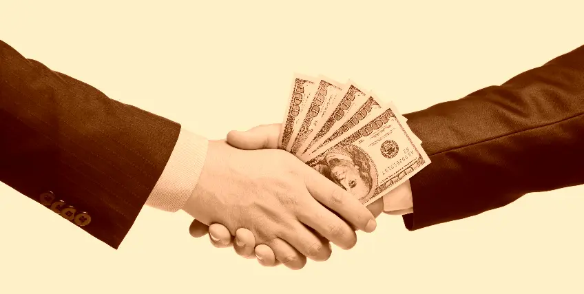 A man is handing another man a bunch of money.