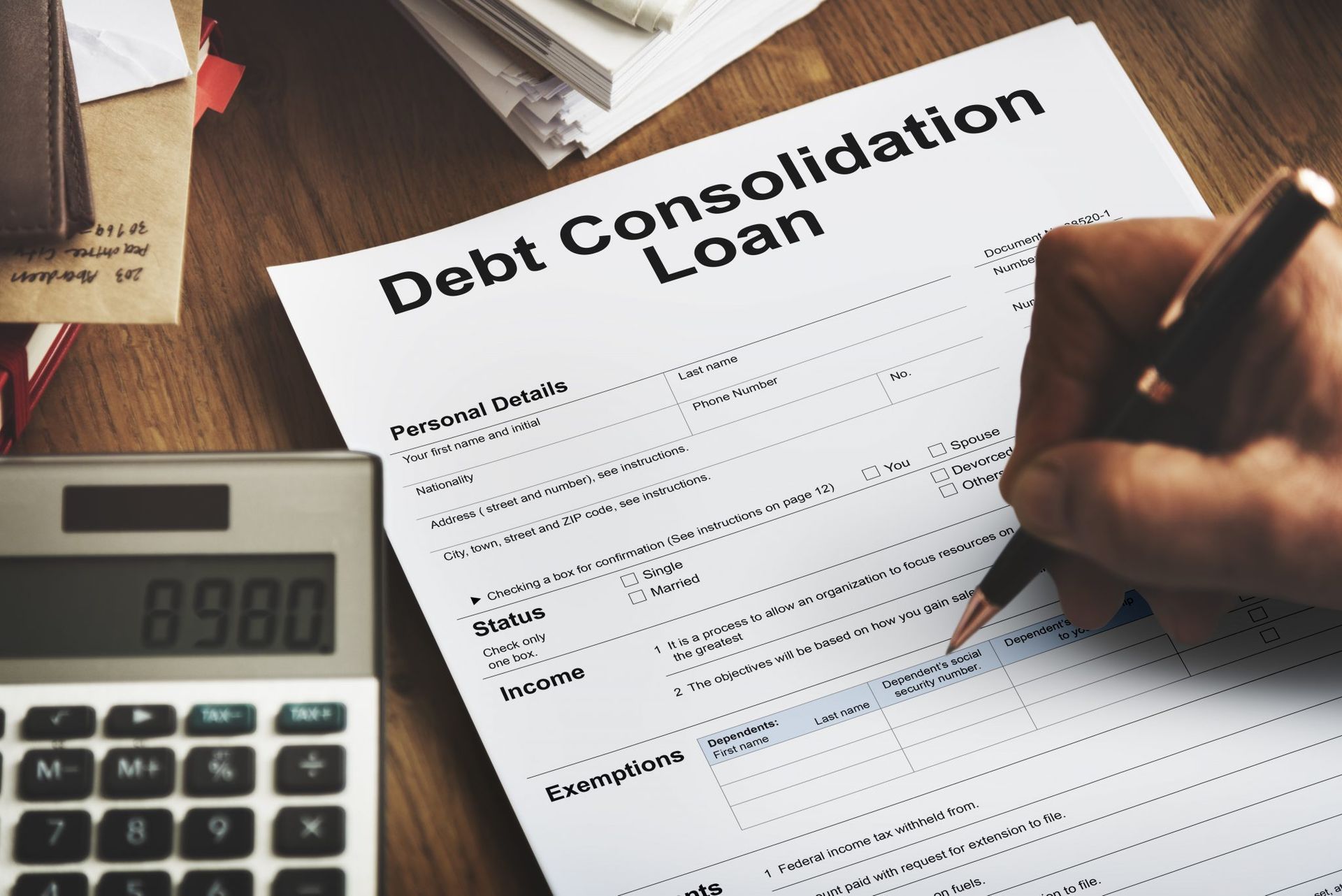 A person is filling out a debt consolidation loan form
