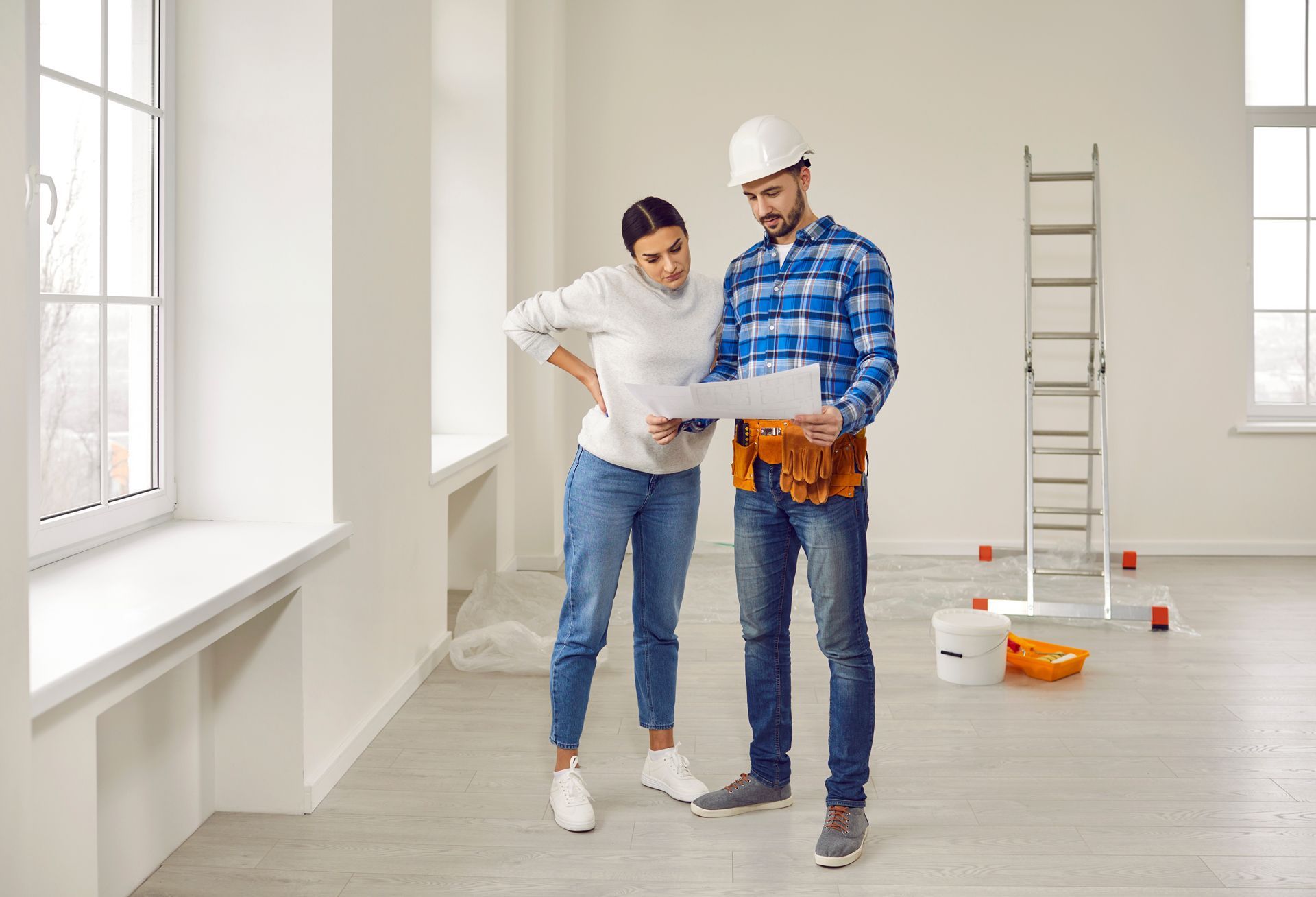 Contractor Showing the Renovation Plan to Homeowner