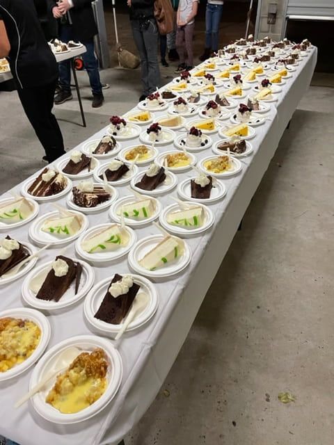 A Long Table With Plates Of Desserts On It — Tru Blu Catering In Laurieton, NSW