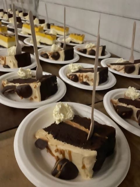 A Row Of Plates With Slices Of Cake On Them — Tru Blu Catering In Port Macquarie, NSW