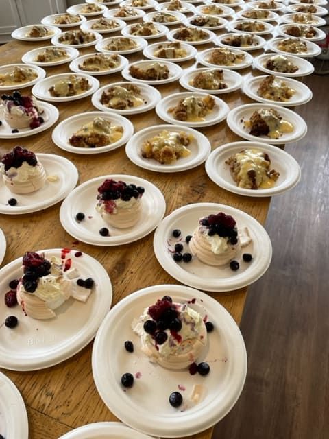 A Table Topped With Plates Of Food With Berries On Them — Tru Blu Catering In Lake Cathie, NSW
