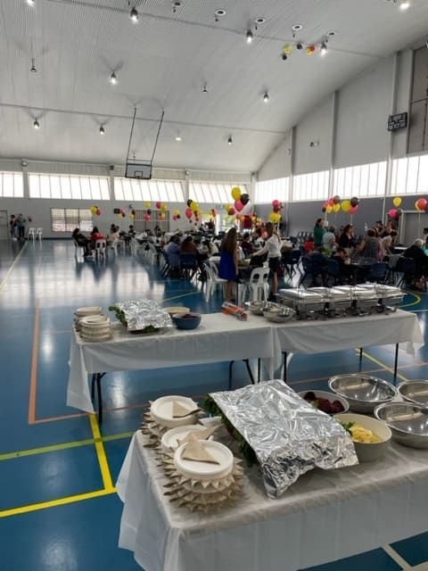 A Bunch Of Tables With Food On Them In A Gym — Tru Blu Catering In Woolgoolga, NSW