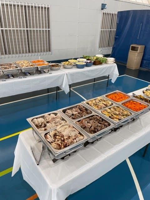 A Buffet Table With Many Trays Of Food On It — Tru Blu Catering In Woolgoolga, NSW