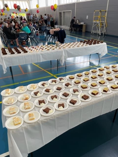 A Table With Many Plates Of Food On It — Tru Blu Catering In Woolgoolga, NSW