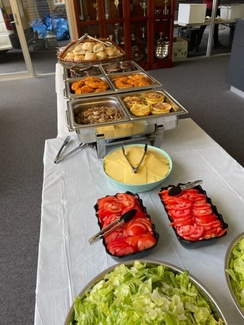 A Buffet Table With A Variety Of Food Including Tomatoes And Lettuce — Tru Blu Catering In Sawtell, NSW