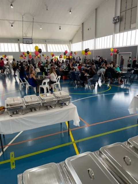 A Large Room With People Sitting At Tables And Buffet Tables — Tru Blu Catering In Woolgoolga, NSW
