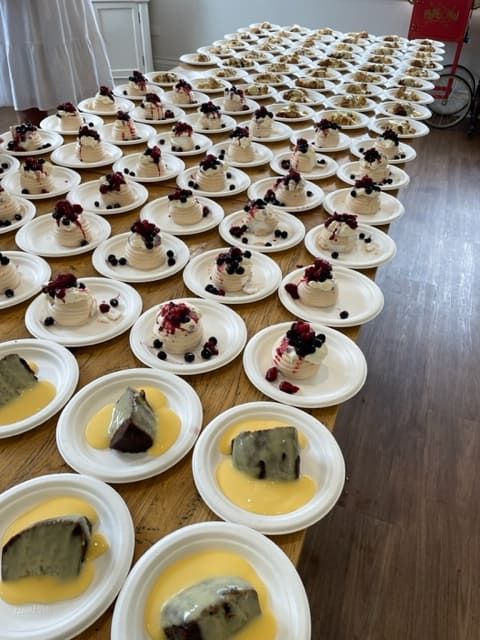 A Table Full Of Plates Of Desserts With Berries On Them — Tru Blu Catering In Lake Cathie, NSW