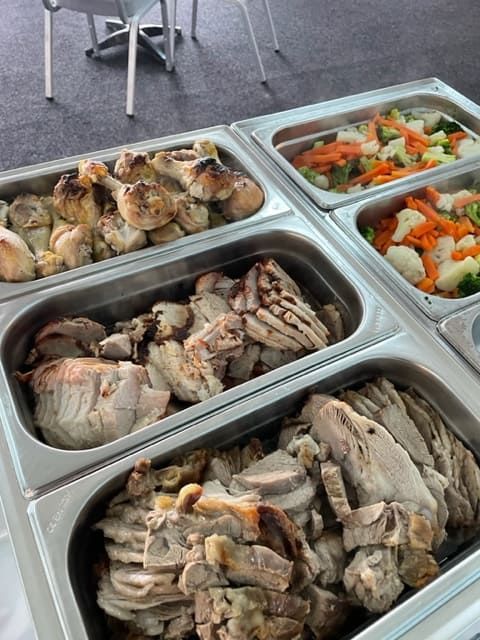 A Buffet Table With A Variety Of Meats And Vegetables — Tru Blu Catering In Laurieton, NSW