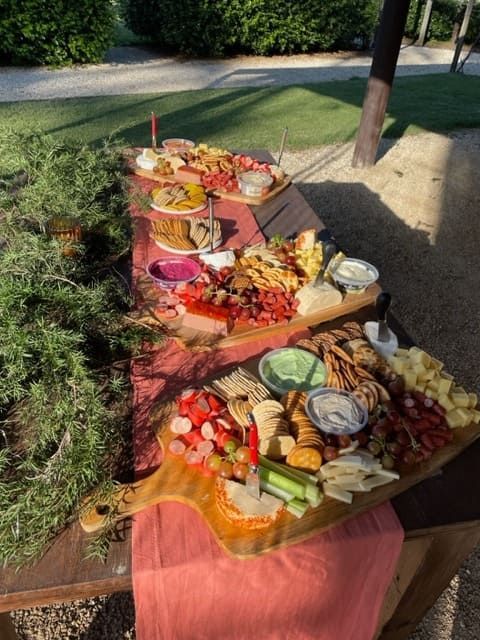 A Wooden Table With A Variety Of Food On It — Tru Blu Catering In Laurieton, NSW