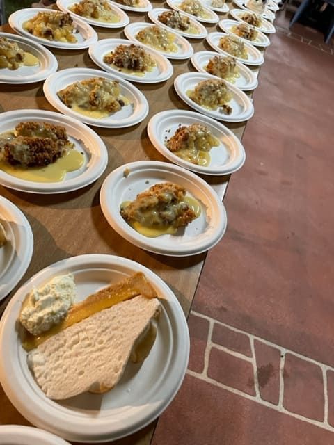 A Row Of Plates With Food On Them On A Table — Tru Blu Catering In Taree, NSW