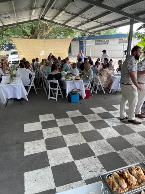 A Group Of People Sitting At Tables Under A Canopy — Tru Blu Catering In Kempsey, NSW