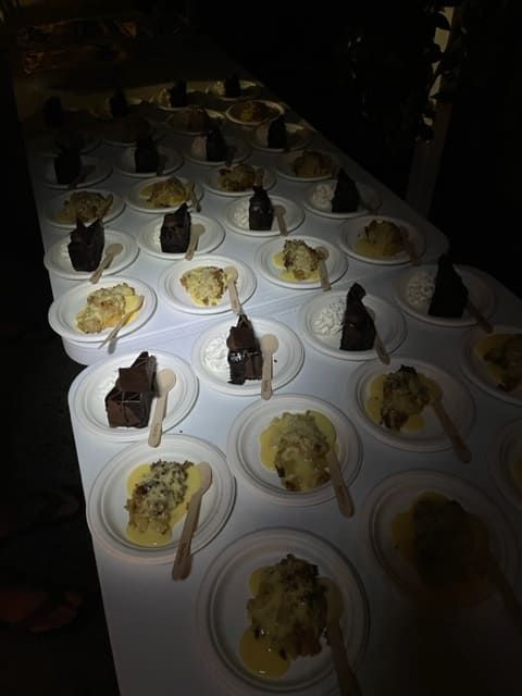 A Table Full Of Plates Of Food With Spoons On Them — Tru Blu Catering In Port Macquarie, NSW