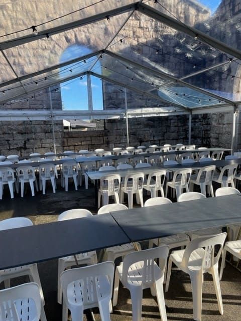 A Clear Tent With Tables And Chairs Underneath It — Tru Blu Catering In Port Macquarie, NSW