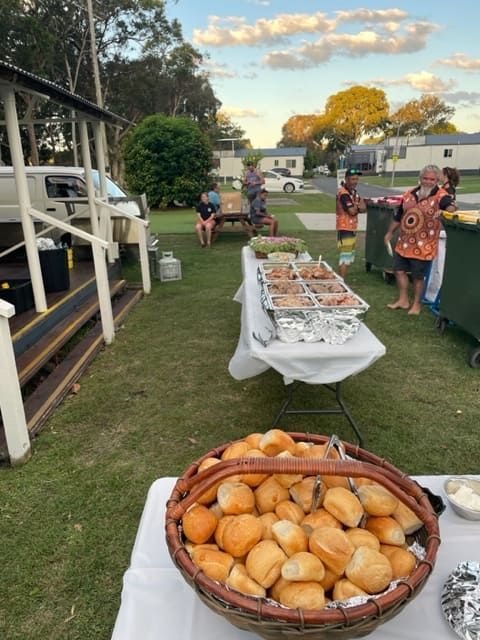 A Basket Of Rolls Sits On A Table Outside — Tru Blu Catering In Port Macquarie, NSW