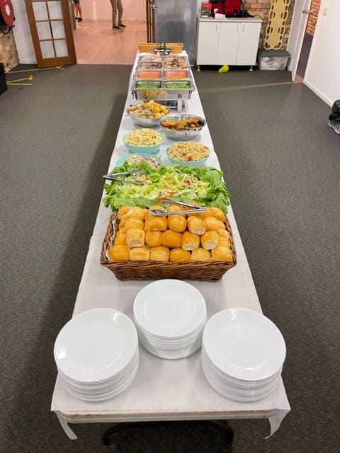 A Long Buffet Table Filled With A Variety Of Food — Tru Blu Catering In Port Macquarie, NSW