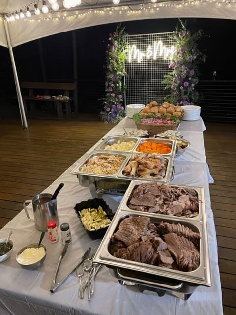 A Buffet Table With Lots Of Food On It Under A Tent — Tru Blu Catering In Port Macquarie, NSW