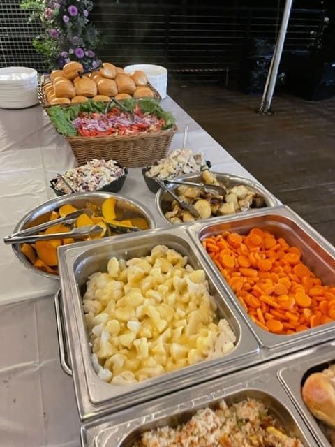 A Buffet Table With A Variety Of Food Including Carrots And Potatoes — Tru Blu Catering In Port Macquarie, NSW