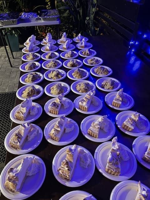 A Table Topped With Plates Of Pie Slices โ Tru Blu Catering In Port Macquarie, NSW