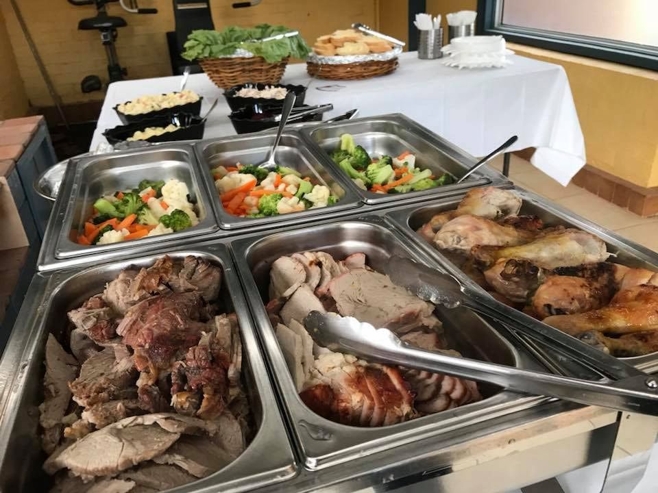 A Buffet Table With A Variety Of Meats And Vegetables — Tru Blu Catering In Nambucca, NSW