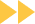Yellow double-chevron arrows pointing right on a white background