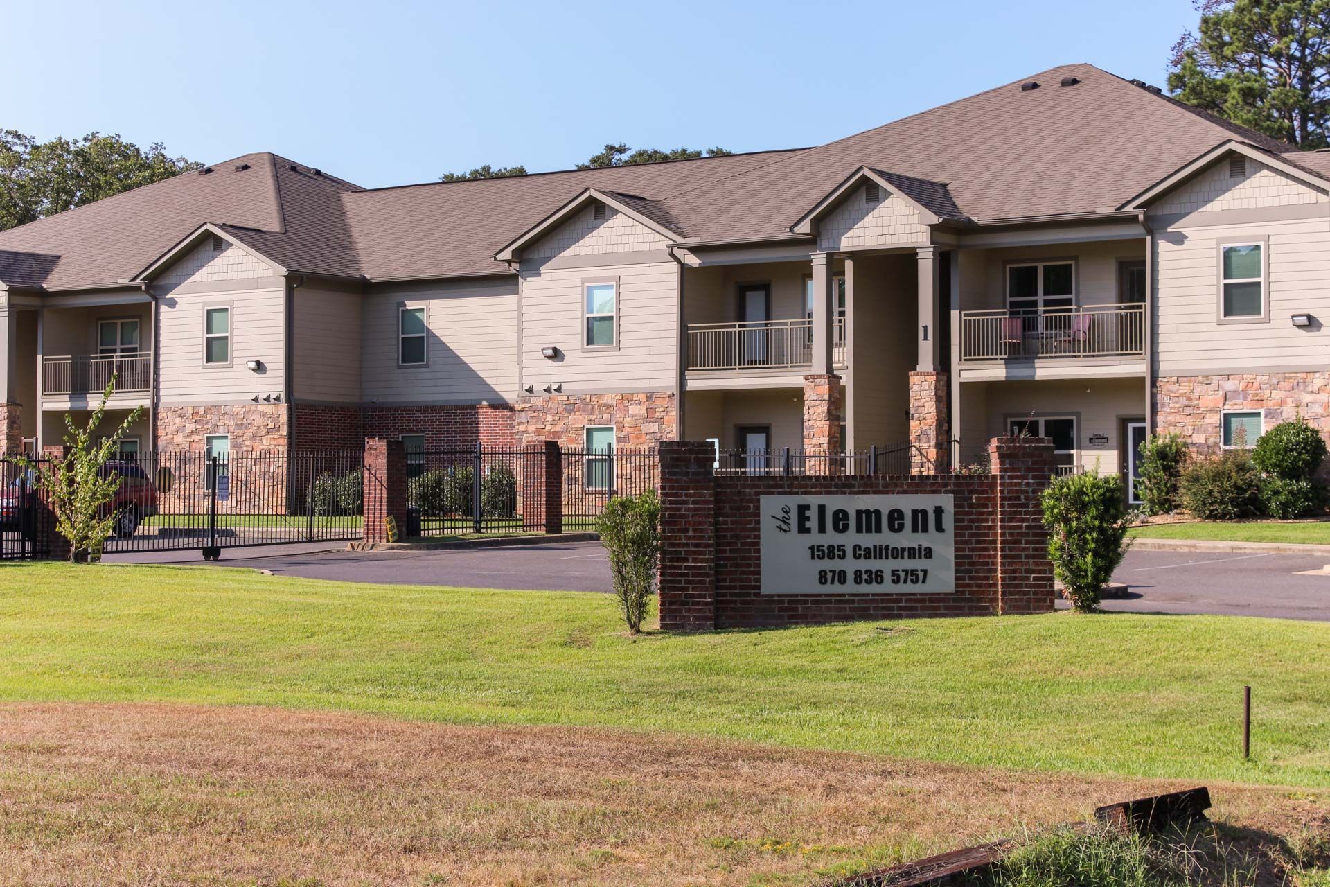 A large apartment building with a sign in front of it that says element