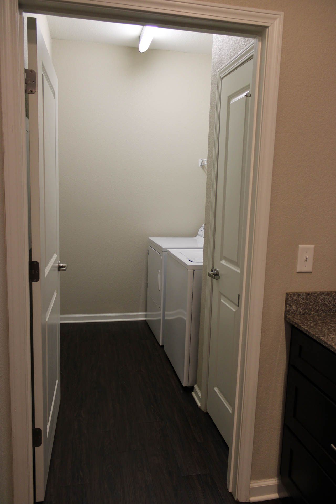 A laundry room with a washer and dryer in it.