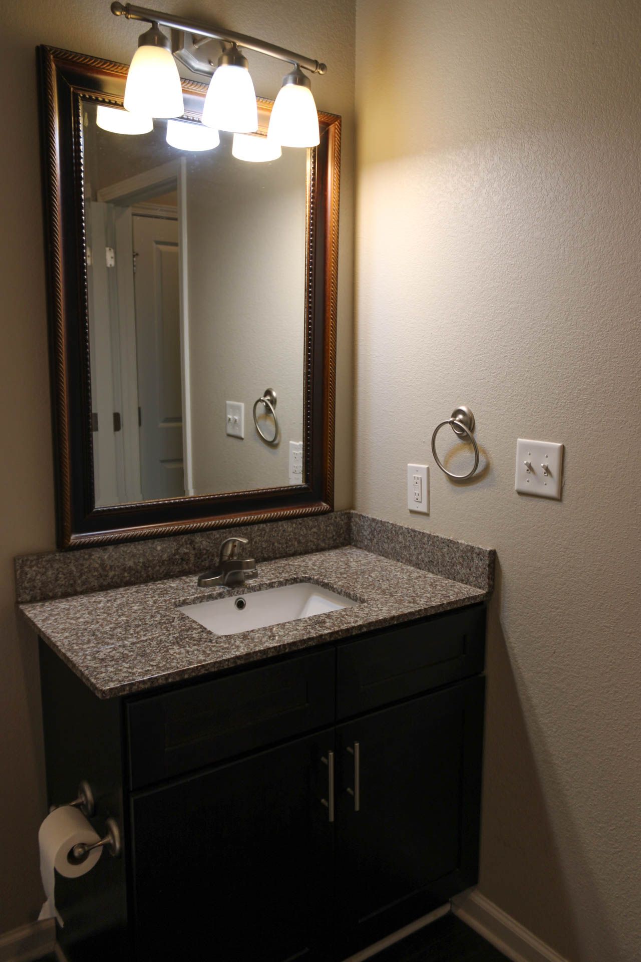 A bathroom with a sink and a mirror