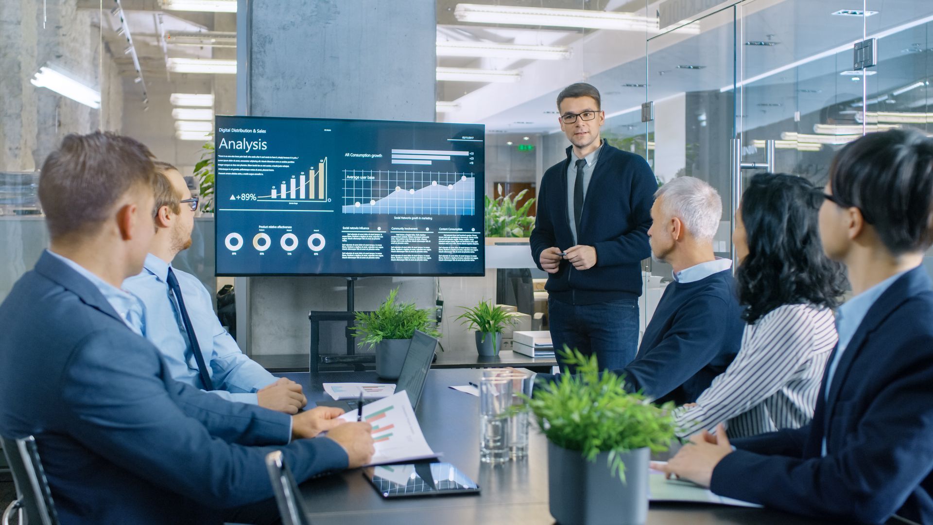 Business Meeting With a Presenter Showing Charts on a TV — MATV Systems Australia Pty Ltd in Wickham, NSW