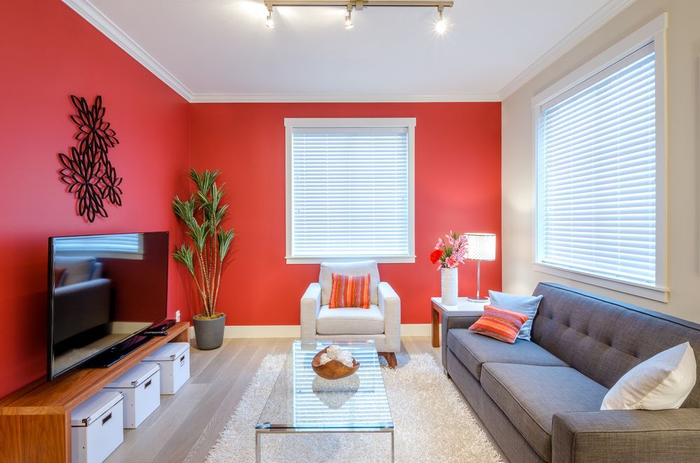 Bright Living Room With Red Walls — MATV Systems Australia Pty Ltd in Wickham, NSW