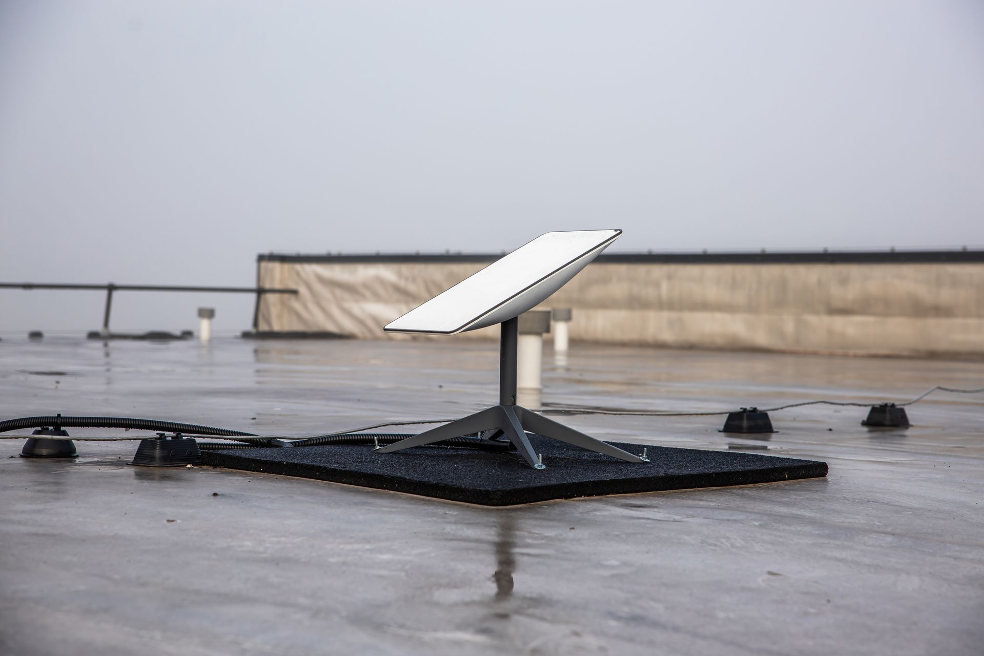Rooftop Starlink Mounted on a Black Stand — MATV Systems Australia Pty Ltd in Wickham, NSW