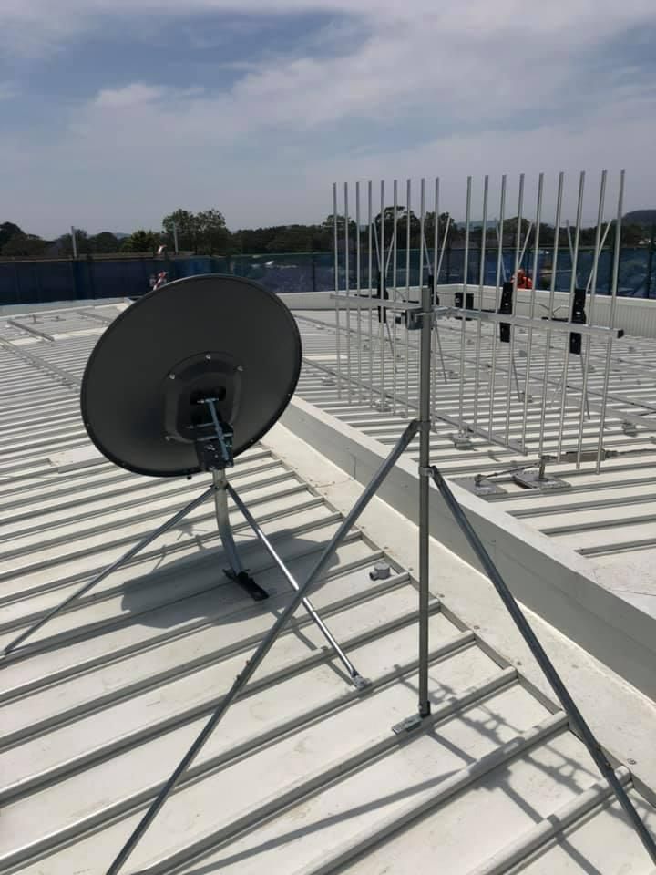 A Satellite Dish Is Sitting on Top of A White Roof — MATV Systems Australia Pty Ltd in Central Coast, NSW