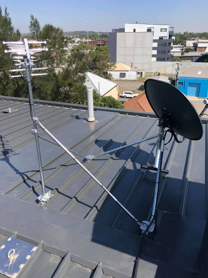 Rooftop With TV Antenna and Satellite Dish — MATV Systems Australia Pty Ltd in Wickham, NSW
