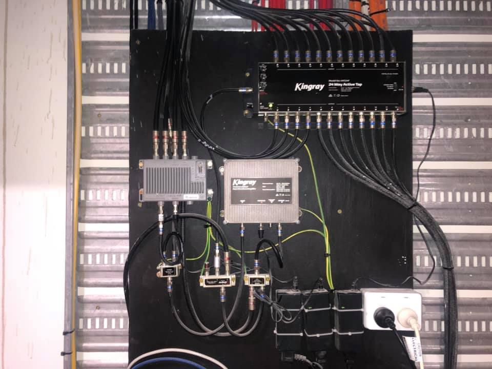 Electrical control panel with wiring, relays, and terminal blocks mounted on a black board — MATV Systems Australia Pty Ltd in Wickham, NSW