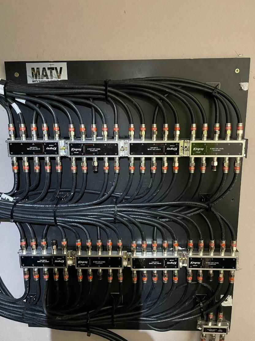 A Bunch of Wires Are Connected to A Wall with A Label that Says MATV — MATV Systems Australia Pty Ltd in Sydney, NSW