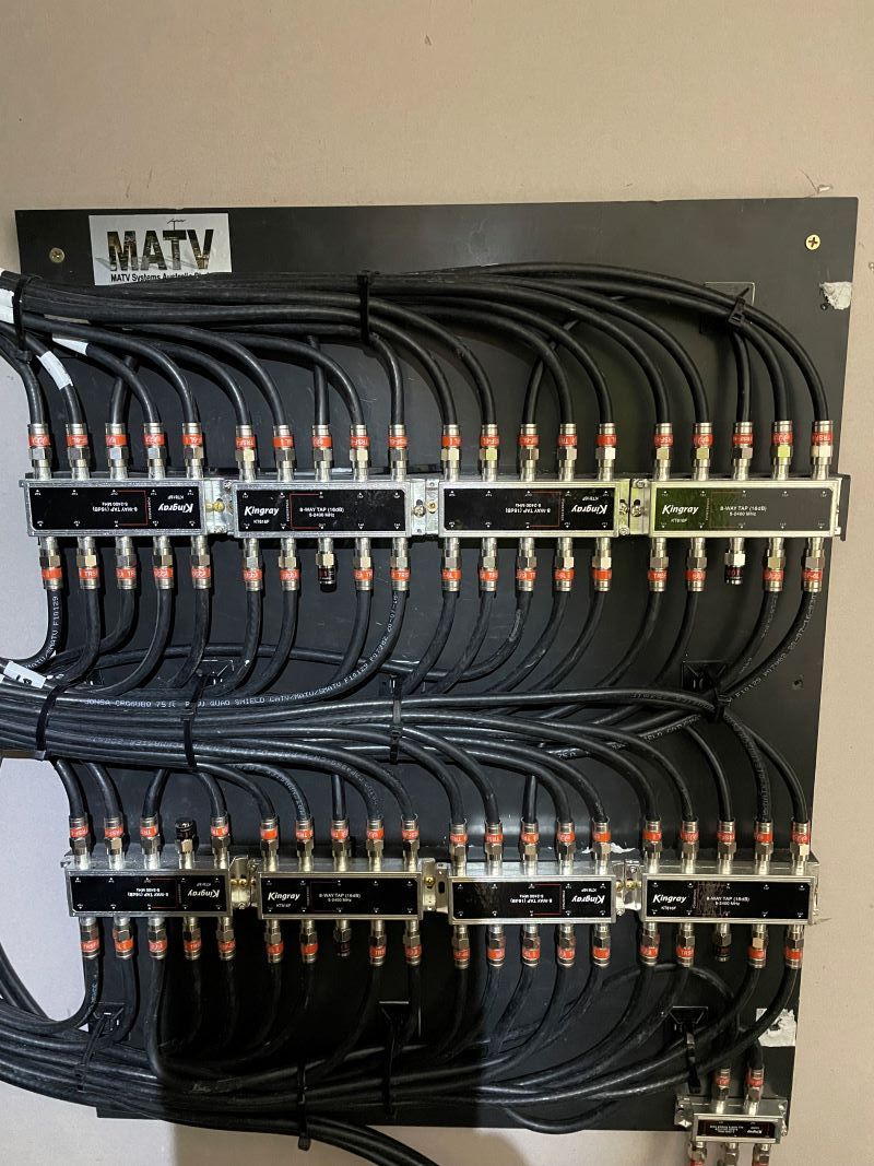 A Bunch of Wires Are Hanging on A Wall — MATV Systems Australia Pty Ltd in Central Coast, NSW