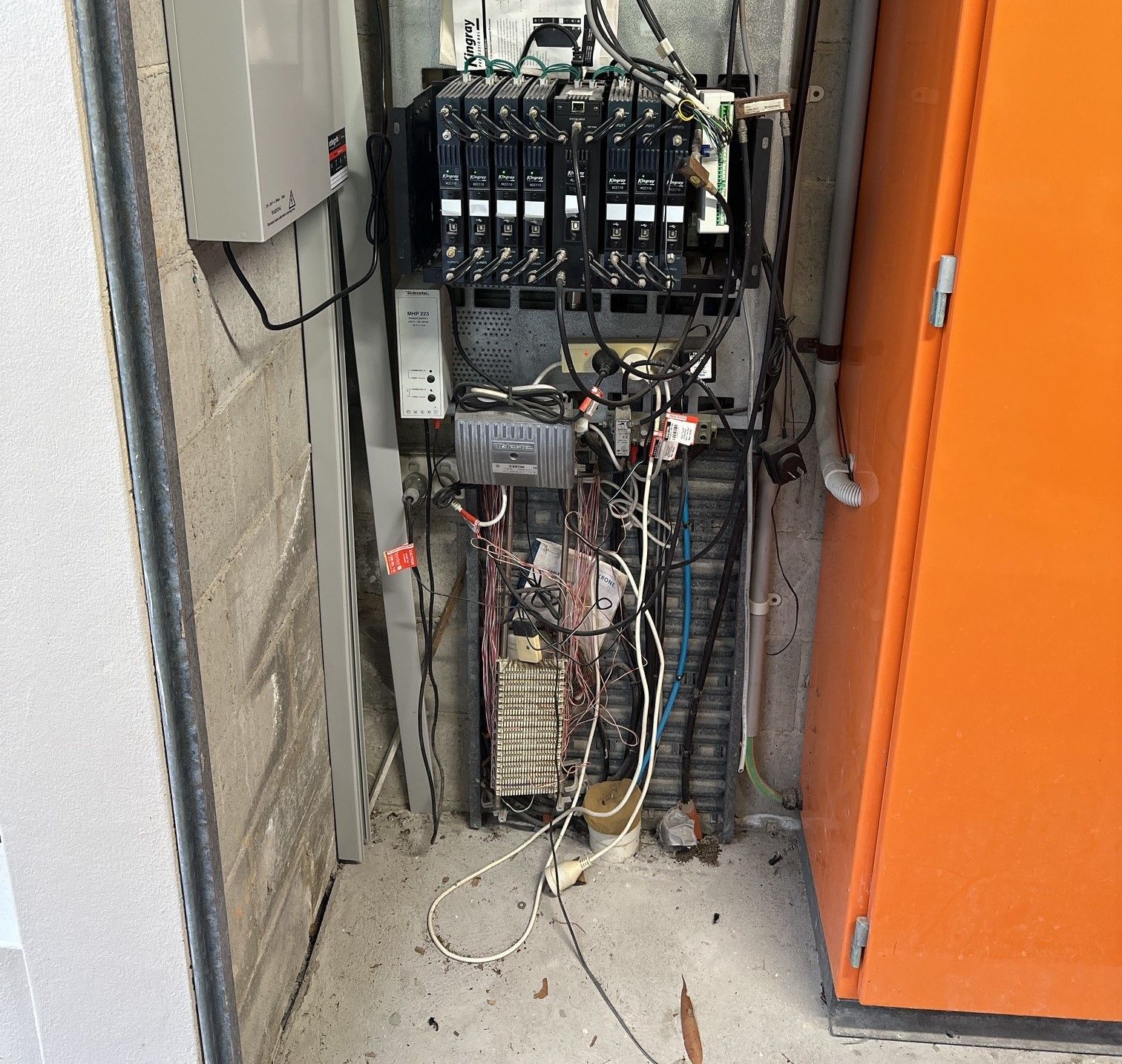 Open Electrical and Network Equipment Cabinet With Tangled Cables — MATV Systems Australia Pty Ltd in Wickham, NSW